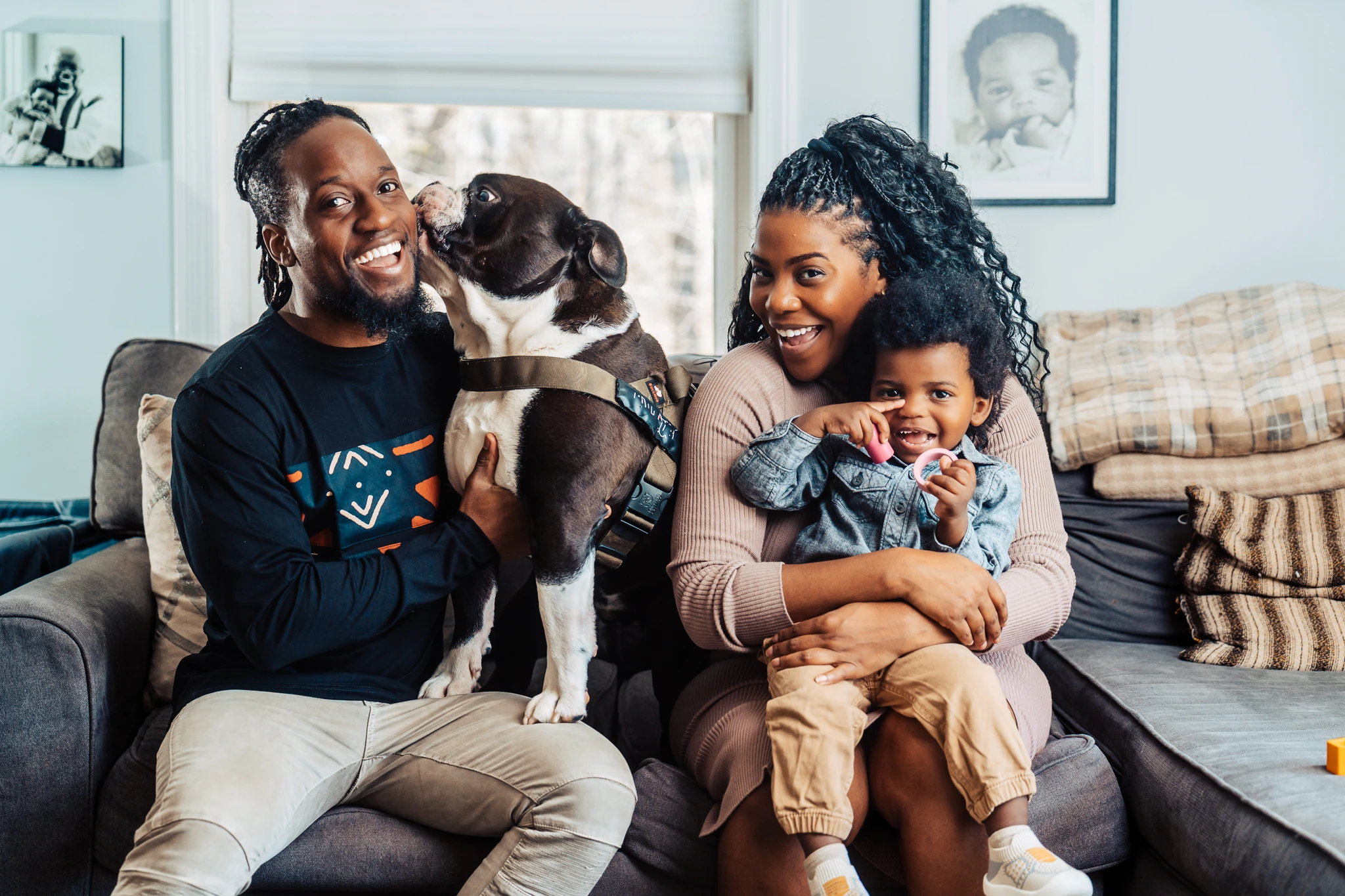 Muyinza with his family and dog at home in South Portland