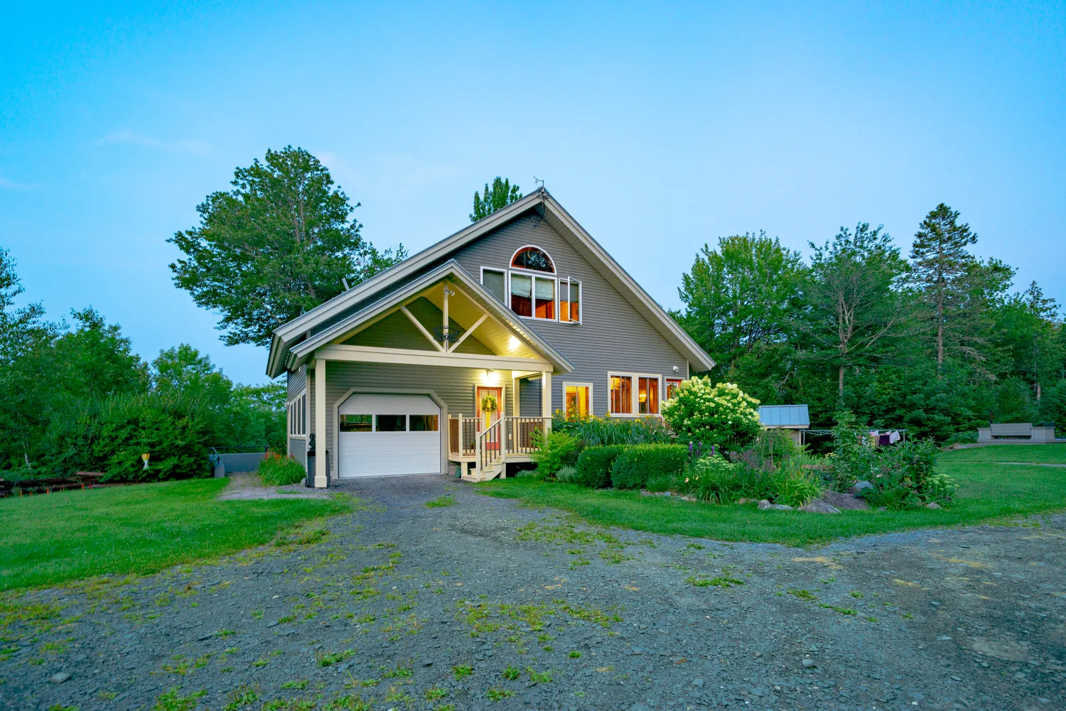 New England home photographed at blue hour
