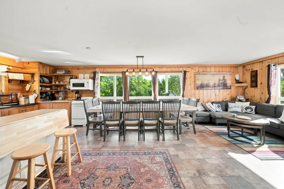 Dragonwood open kitchen, dining area, and living room photographed by Flyover Creative