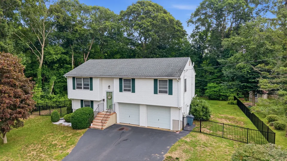 Aerial exterior photograph of a coastal New England home by Muyinza Kasirye
