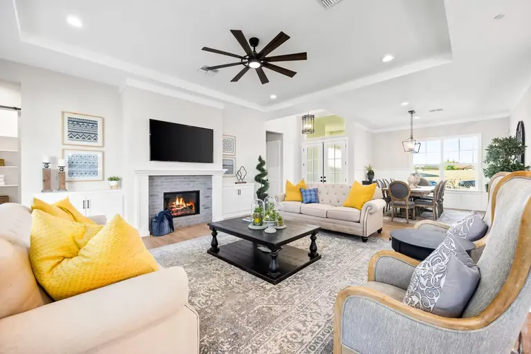 Furnished living room with seating scaled to the open-plan space
